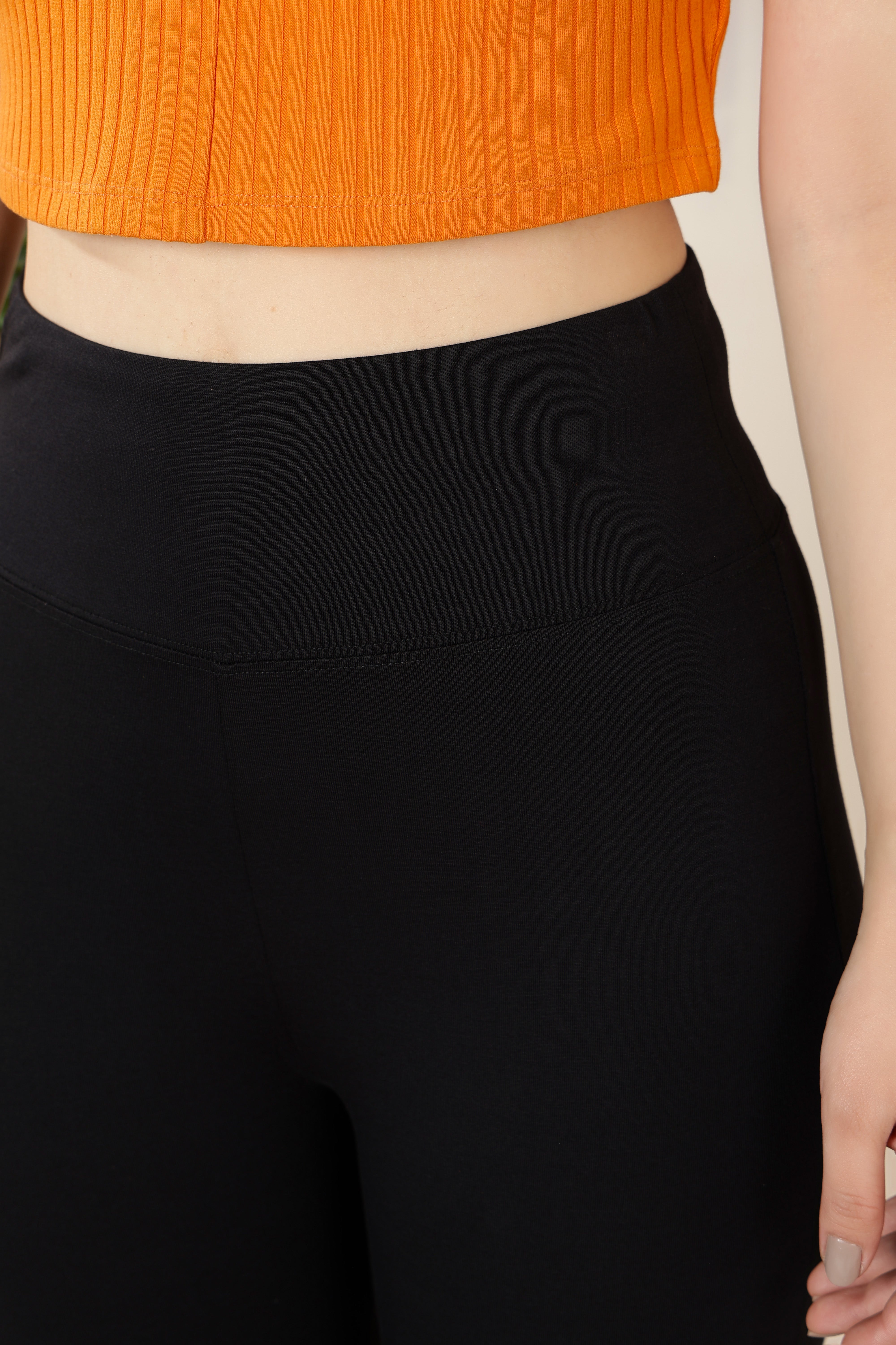 Black stretchable biowash cotton lycra flare legging with superior elastic belt.