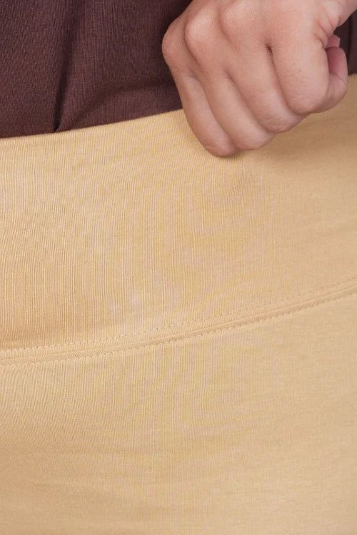 Beige stretchable biowash cotton lycra flare legging with superior elastic belt. -Cotton flare