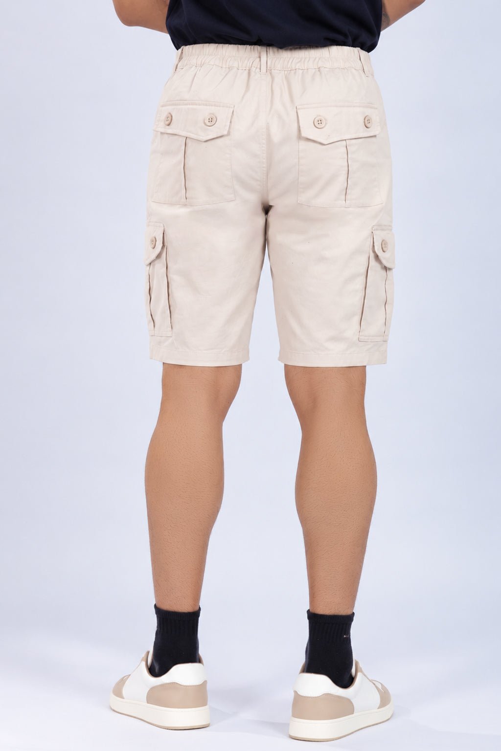 Off white stretchable biowash HQ cotton travel shorts with superior elastic belt. -Travel shorts