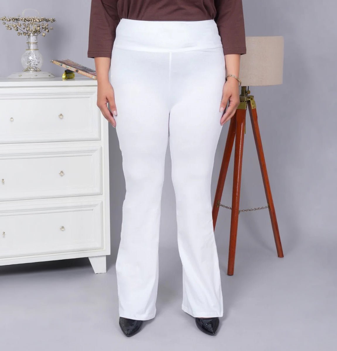 White stretchable biowash cotton lycra flare legging with superior elastic belt. -Cotton flare