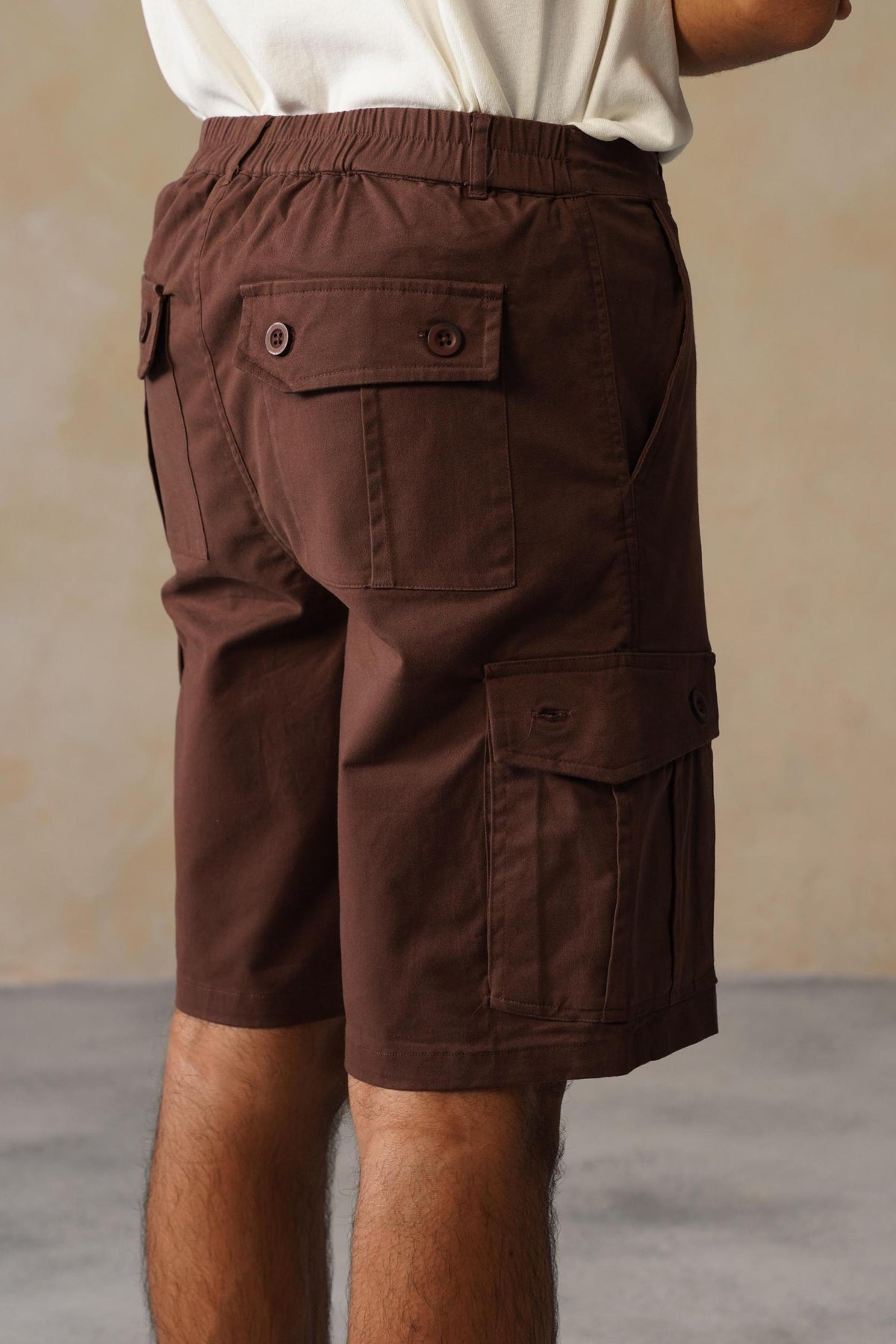 Men coffee stretchable biowash HQ cotton travel shorts with superior elastic belt.
