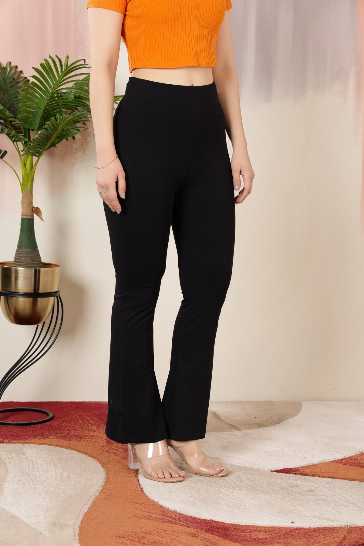 Black stretchable biowash cotton premium lycra flare legging with superior elastic belt. -Cotton flare