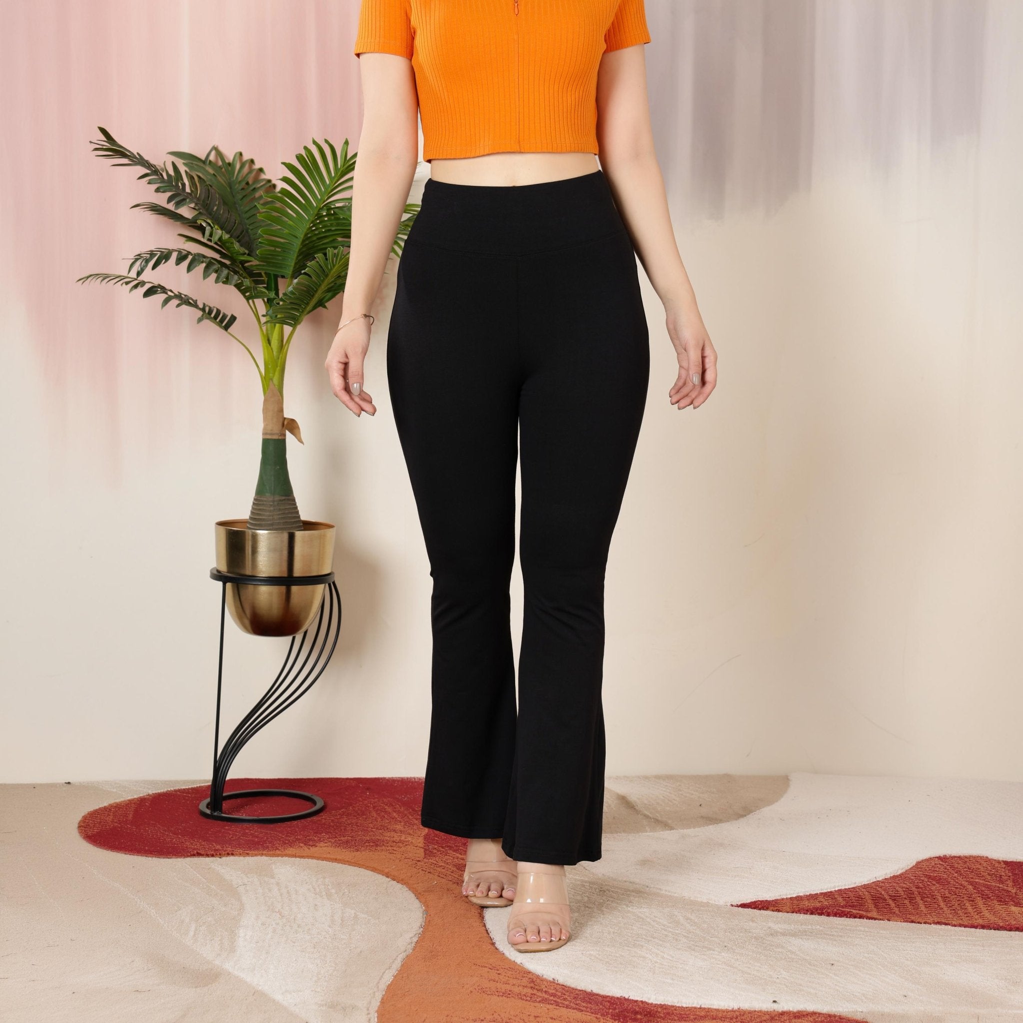 Black stretchable biowash cotton premium lycra flare legging with superior elastic belt. -Cotton flare
