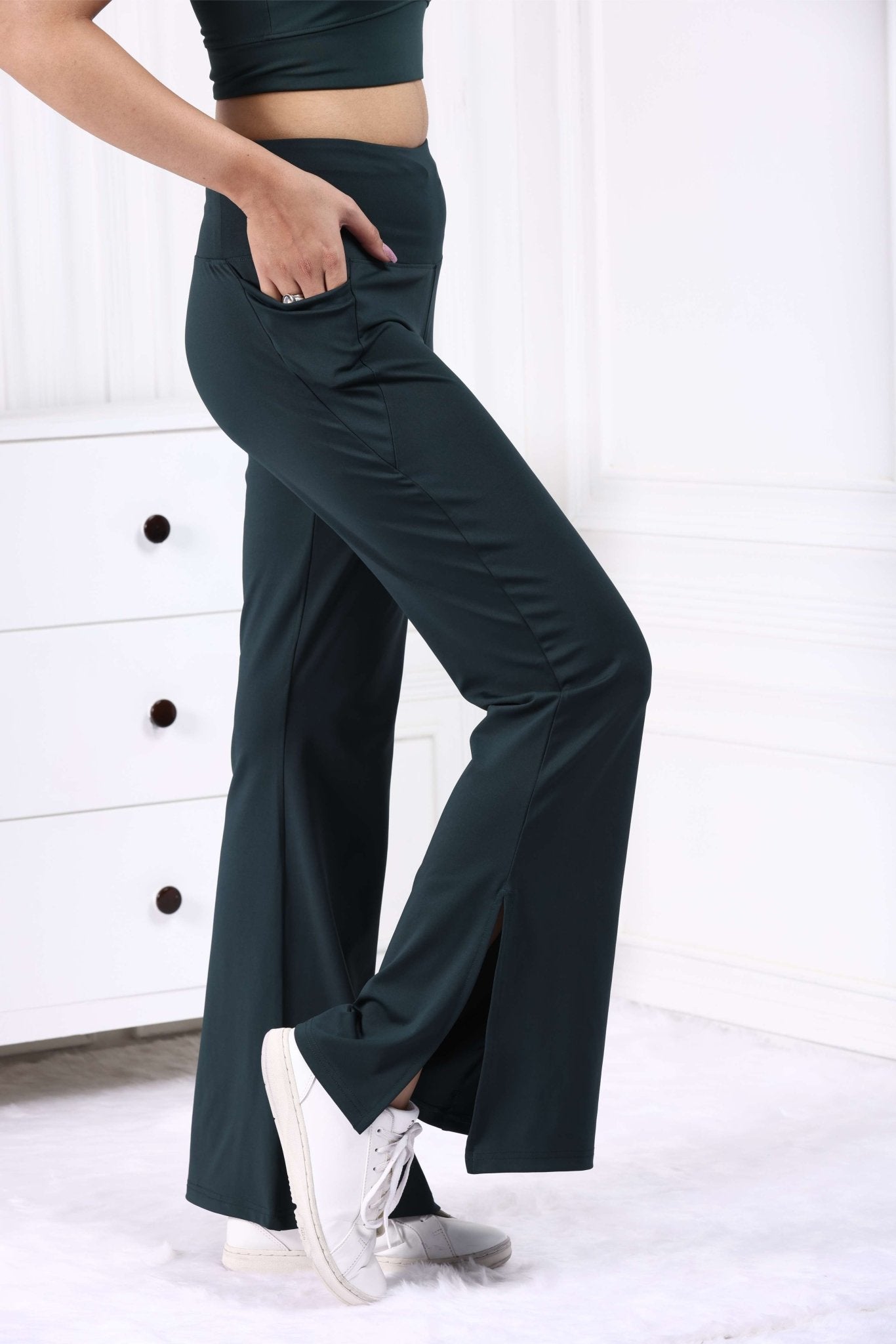 Dark green sports flare pants with slit for women, ankle length