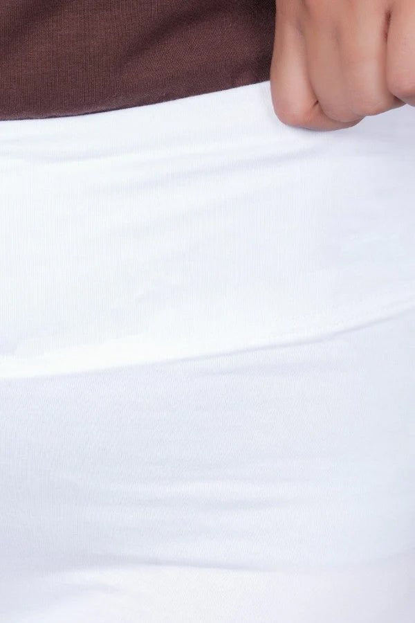 White stretchable biowash cotton lycra flare legging with superior elastic belt. -Cotton flare