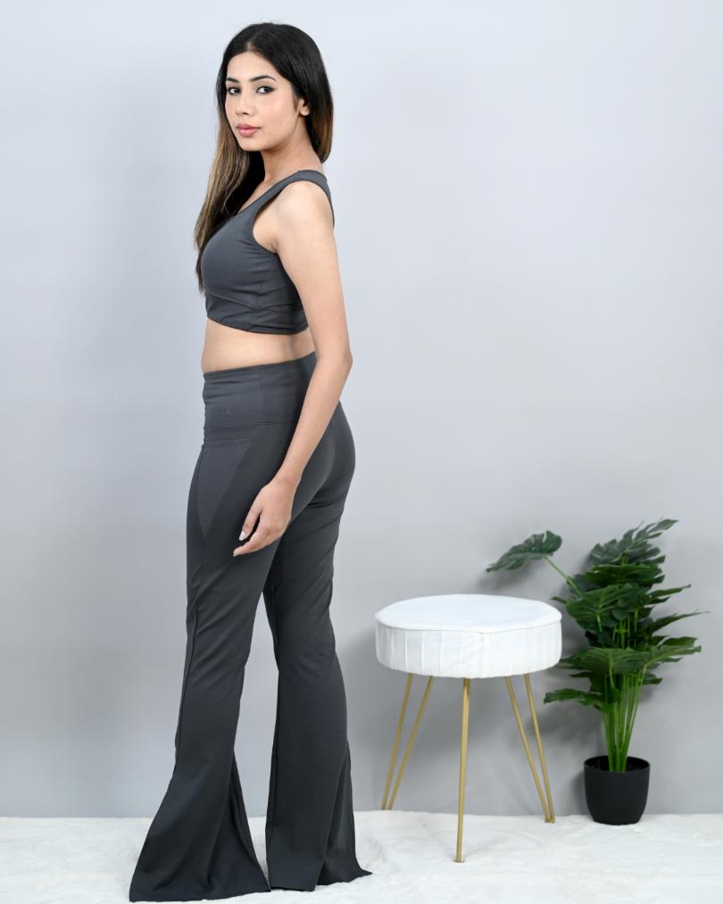 Dark grey sports flare pants with slit for women, ankle length gym pants.